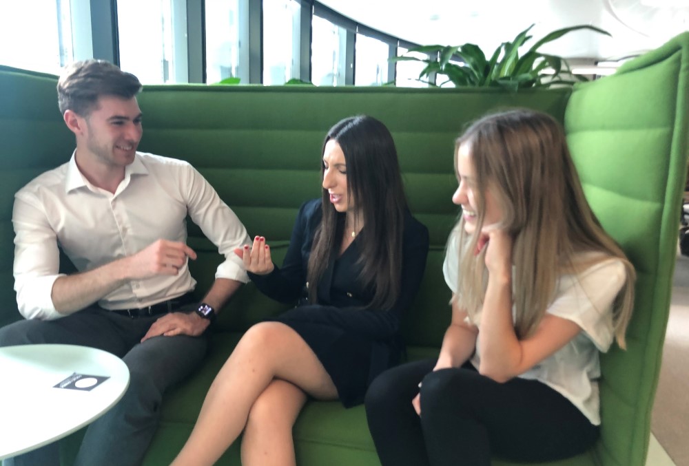 Capgemini Australia Graduate - Young female professional catching up with two fellow graduates.