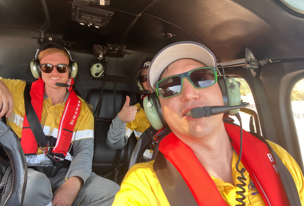 Energy Queensland - Dane Thomas in the aircraft with the pilot